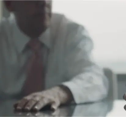 A man sitting on office table